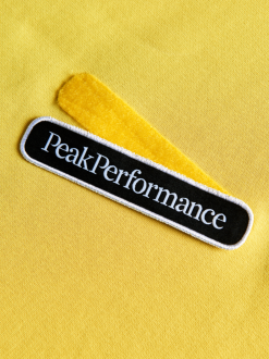 PeakPerformance PEAK PERFORMANCE SEASONAL PATCH HOOD MEN Citrine -Snow Kleding Verkoopwinkel schermafbeelding 2021 10 09 om 16.11.32