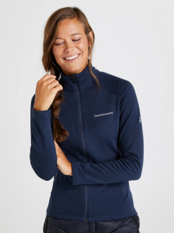 PeakPerformance PEAK PERFORMANCE VERTICAL MID ZIP JACKET WOMEN Blue Shadow -Snow Kleding Verkoopwinkel schermafbeelding 2022 11 10 om 17.00.37